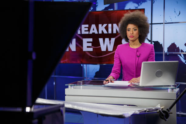 istock Breaking news female anchor 2195085652