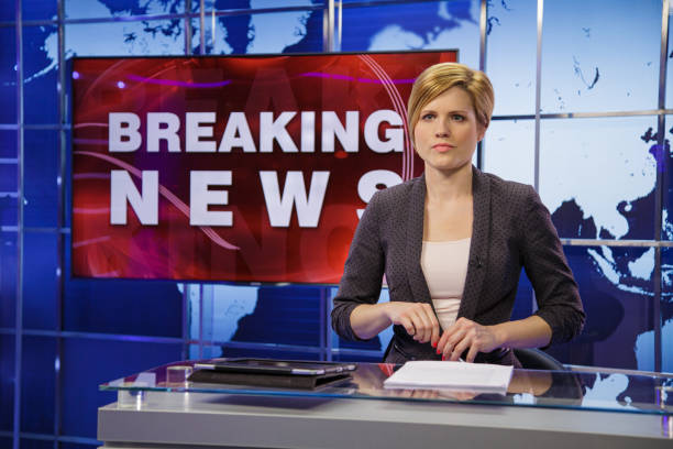istock Breaking news female anchor 2195085725