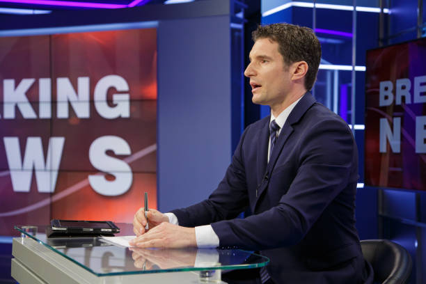 istock Breaking news male anchor 2195085748