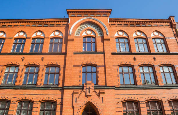 istock Front facade of a red brick building in Torun 2195087674