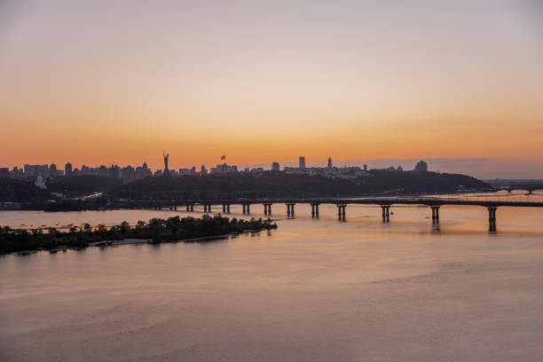 istock Modern bridge in Kyiv over a river during sunset with cityscape 2195087818