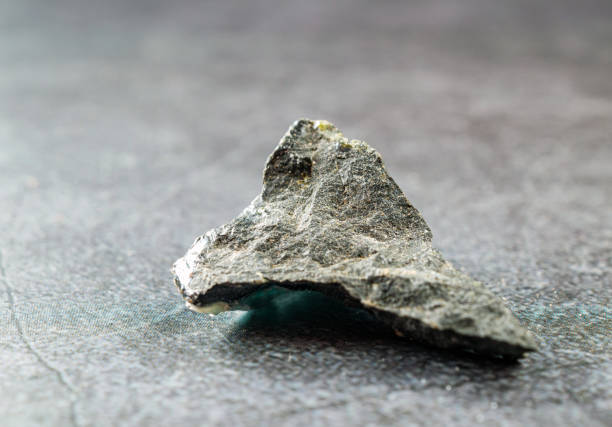 istock Close-up of basalt stone on gray background 2195088435