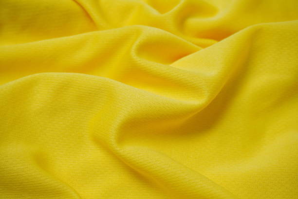 istock texture background of yellow fabric with ripples and waves 2195091065