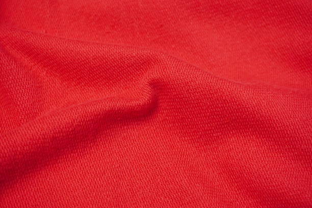 istock red fabric of sweater with ripples and waves texture background 2195091082