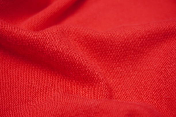 istock texture background of red fabric sweater with ripples and waves 2195091104