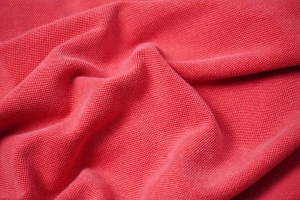 istock texture background of red cotton fabric with ripples and waves 2195091153