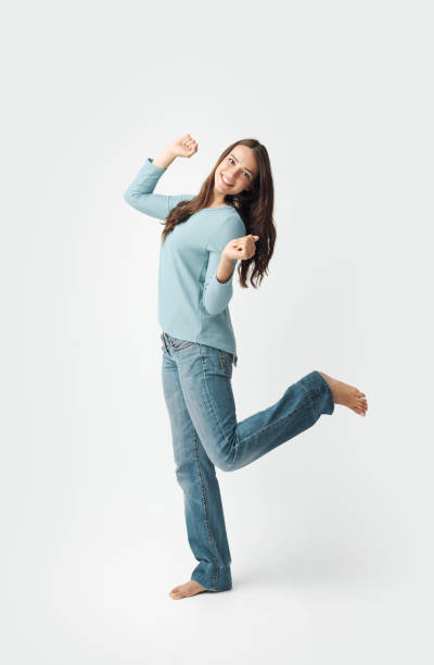 istock Cheerful happy woman standing and smiling at camera 2195091202