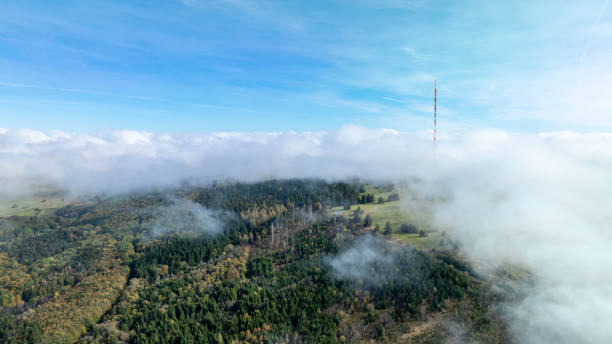 Fog and clouds over mountains and woodlands