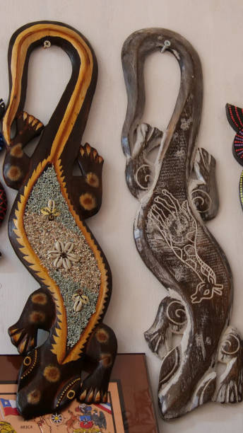 istock Vertical image of Wooden lizards mounted on a wooden board. 2195091913