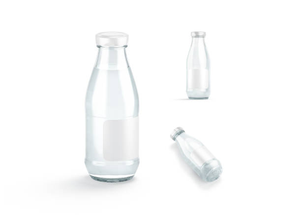 Blank transparent glass water bottle white label mockup, different views, 3d rendering. Empty acrylic bottles with mineral drink mock up, isolated. Clear refreshment fizz tonic bottled template.