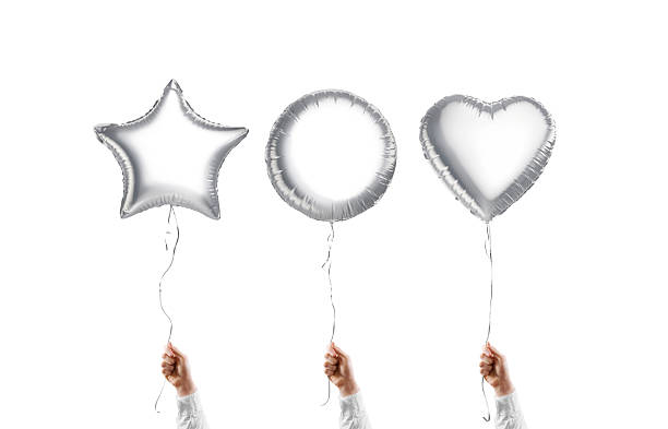Hand holding blank silver star, round and heart balloon mockup