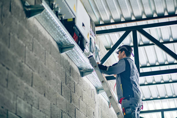 istock Engineer repairing a solar energy inverter system 2195094418
