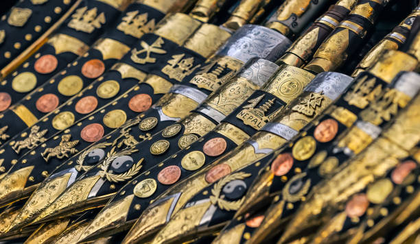 A vibrant assortment of traditional decorative knives, showcasing intricate metal engravings and patterns, culturally significant to Nepal. Captured in high detail, highlighting craftsmanship and artistic excellence.