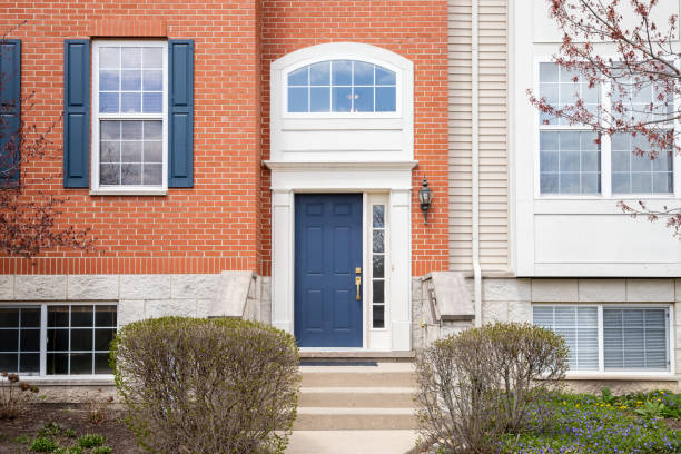 istock A blue front door on a red  brick home. 2195096996