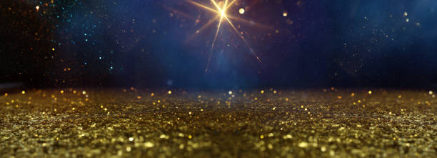 istock background of abstract glitter lights. gold, blue and black. de focused 2195099462