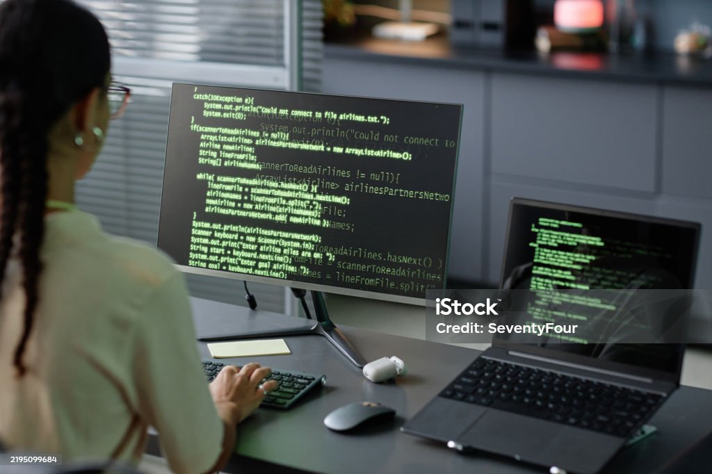 programmingprogramingprogramerinformaticscodecode... Female It Programmer Coding On Computers Using Multiple Screens At ...