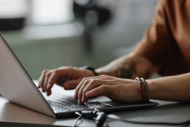 istock Hands of Male Programmer Typing on Laptop Keyboard Working in Office 2195099690