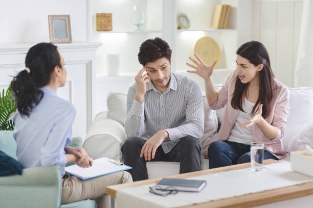 istock Couple talking with their therapist in office 2195099865