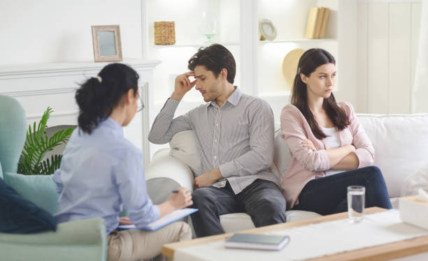 Couples Therapy Session in a Comfortable Living Room With a Professional Counselor Present