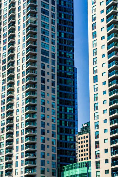 istock Modern High-Rise Apartment Buildings Against a Clear Blue Sky 2195100911
