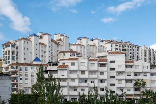 An image of part of the small town of Estepona in Spain showing how the houses are designed there, with a blue sky in the background.