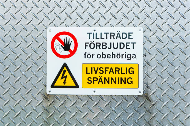 istock Safety warning sign indicating restricted access and high voltage near industrial area 2195103638