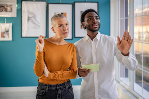 istock Engaging discussion between art enthusiasts at a contemporary gallery during an exhibit opening 2195104272