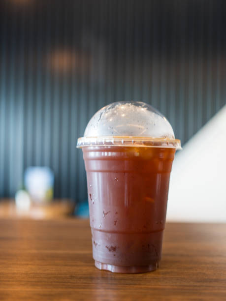 istock Side view of iced dark cold brew on the wood bar table. 2195105267