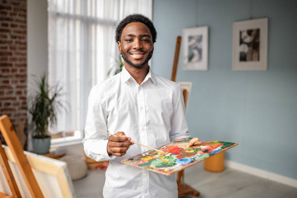 istock Creativity flows as artist holds palette in bright art studio filled with natural light and art supplies 2195105735