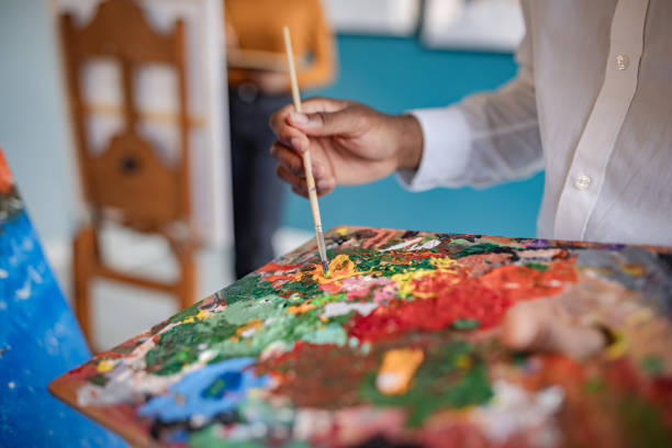 istock Creative process in an art studio with vibrant colors and focused artist 2195106006
