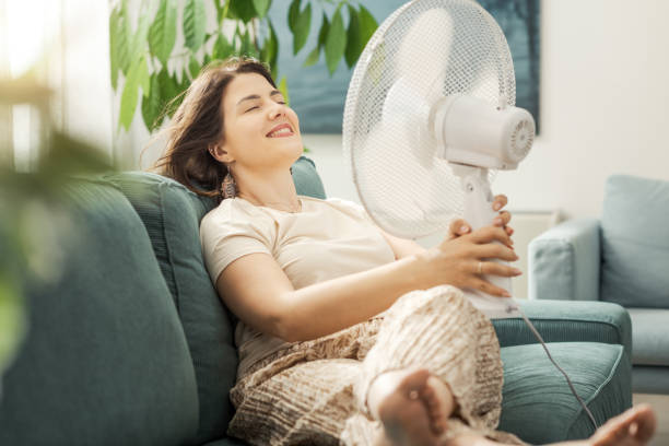 istock Woman blowing fresh air on her face 2195106585