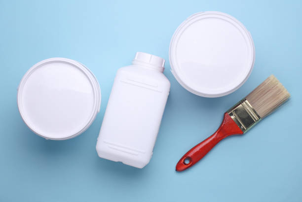istock Clean paintbrush with paint cans on blue background. Top view 2195107418