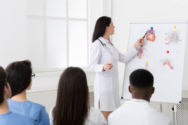 istock Cardiologist sharing experience with colleagues at seminar 2195107669