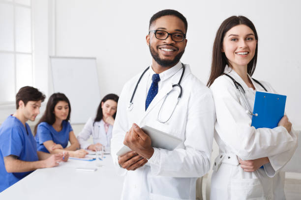 istock Diverse Professional Doctors In White Coats Posing To Camera At 2195107754