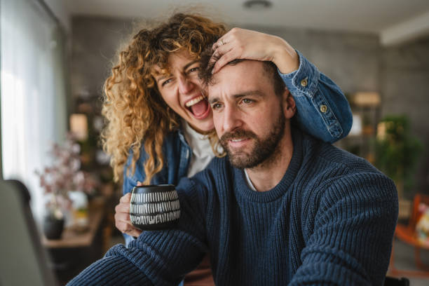 istock Happy couple enjoying together while browsing digital tablet screen 2195108240