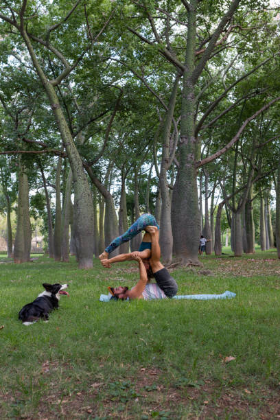 istock Couple practicing acroyoga in green park in daytime 2195109183