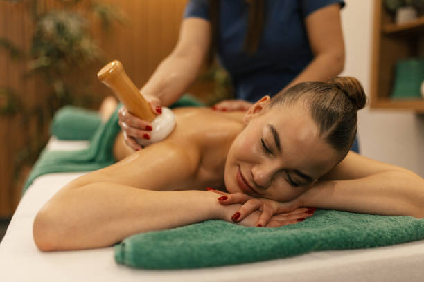 istock A woman having a gua sha massage 2195109264