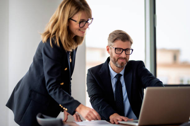 istock Group of business people working in a modern office 2195110429