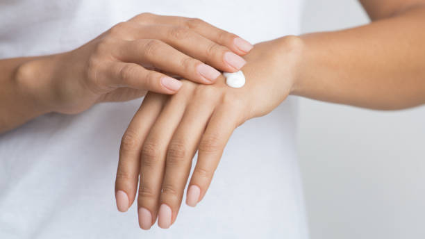 istock Young Skin. Woman Applying Moisturizing Hand Cream 2195111822
