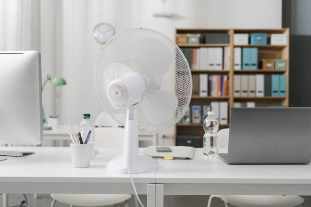 Office interior with electric fan