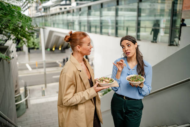 istock Businesswomen enjoying lunch outdoors in Sydney while discussing ideas and networking 2195113916