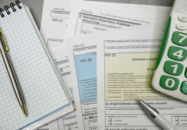 istock Polish tax forms PIT 36 PIT 37 PIT 38 with pen personal income tax 2195116476