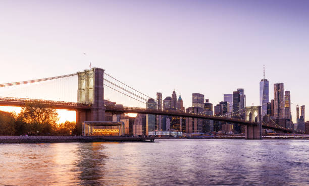 istock A panoramic sunset view of the Brooklyn Bridge stretching towards Manhattan 2195117387