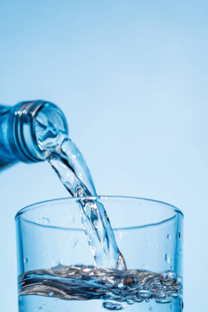 istock Crystal clear water being poured into a transparent glass, creating refreshing ripples and bubbles 2195117689
