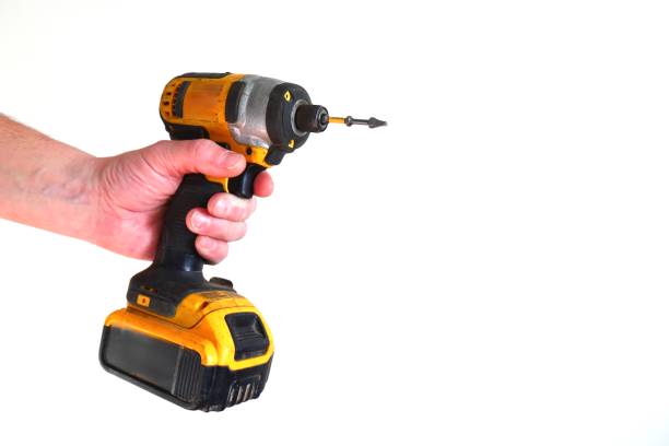 istock Cordless drill in hand on and in background close-up 2195118900