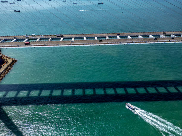 istock Arial View of Bridge and Boat Shadow Over Turquoise Waters 2195122037