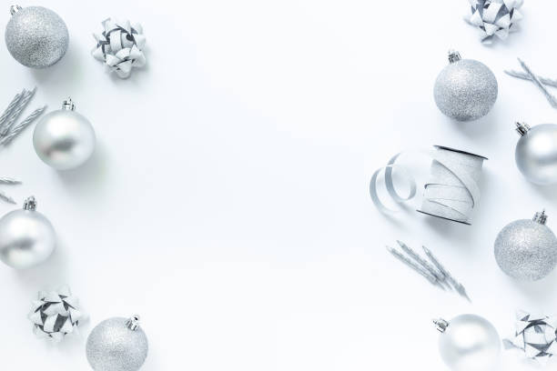 istock Frame of silver Christmas and New Year decorations on white background. Top view 2195122112