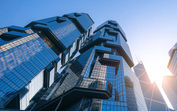 istock Modern Skyscrapers in Hong Kong Under Clear Blue Sky 2195122308