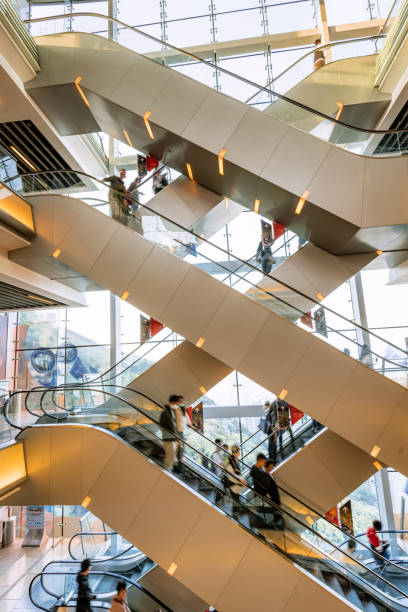istock Modern Indoor Escalators With People in a Busy Shopping Mall 2195122482