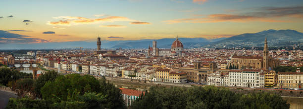 istock Florence at sunset, panoramic view of the Arno river, with ponte Vecchio, palazzo Vecchio and cathedral of Santa Maria del Fiore, Italy 2195122514